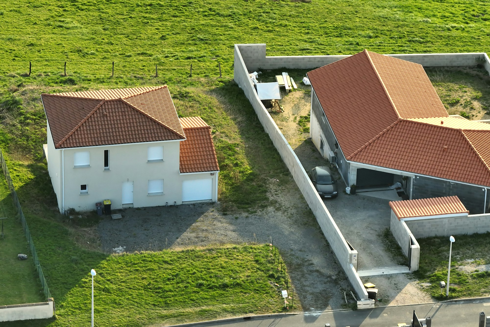 Aerial view of residential houses in green suburban rural area