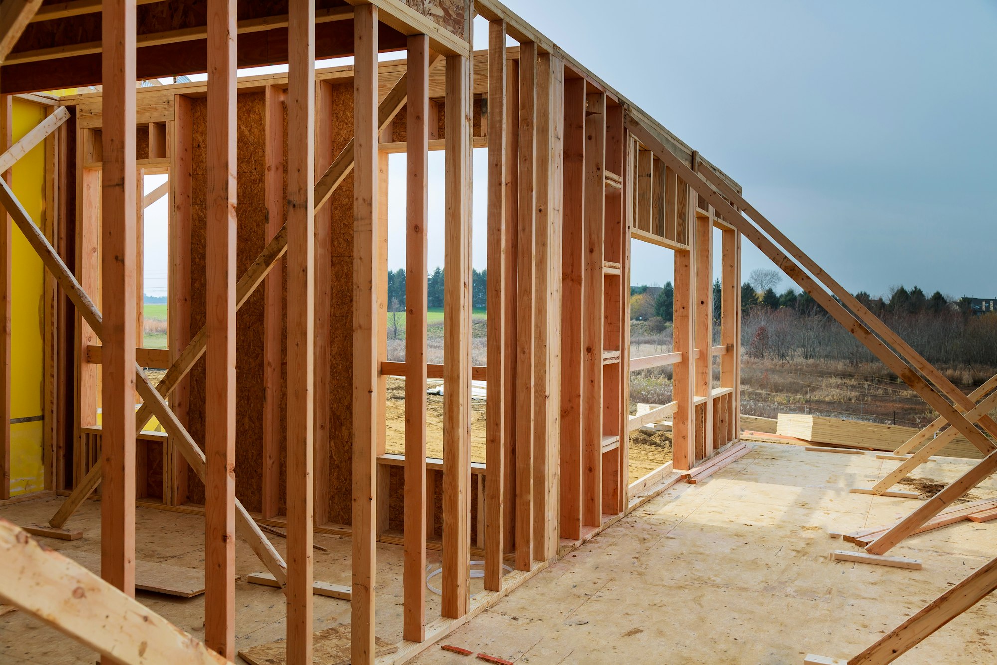 Wooden roof during the early stages of construction in a sunny day